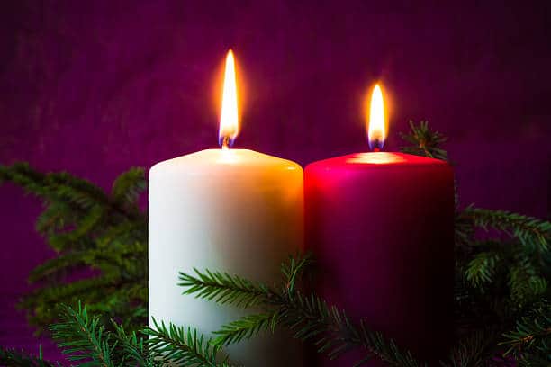 Christmas ornaments. Lighted candles and spruce twigs Christmas ornaments. Lighted candles and spruce twigs